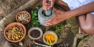 a-young-man-preparing-ayurvedic-medicine-in-the-traditional-manner-fotolia